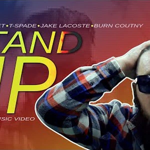 Still from the Stand Up music video